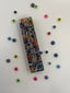 The one with the evil eye beads